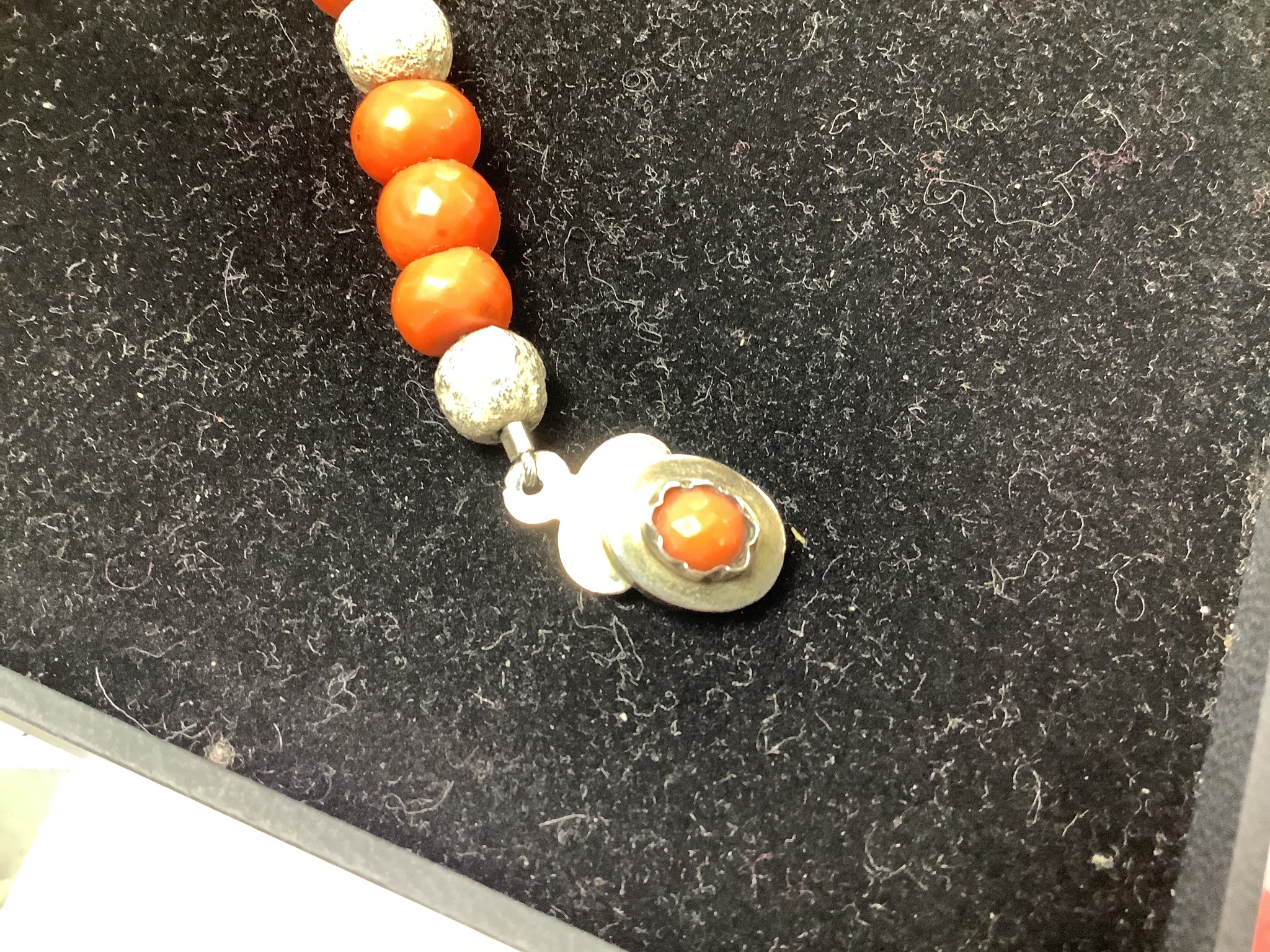 A modern Pruden Smith coral and white metal bead necklace, approx. 42cm and a pair of matching drop earrings